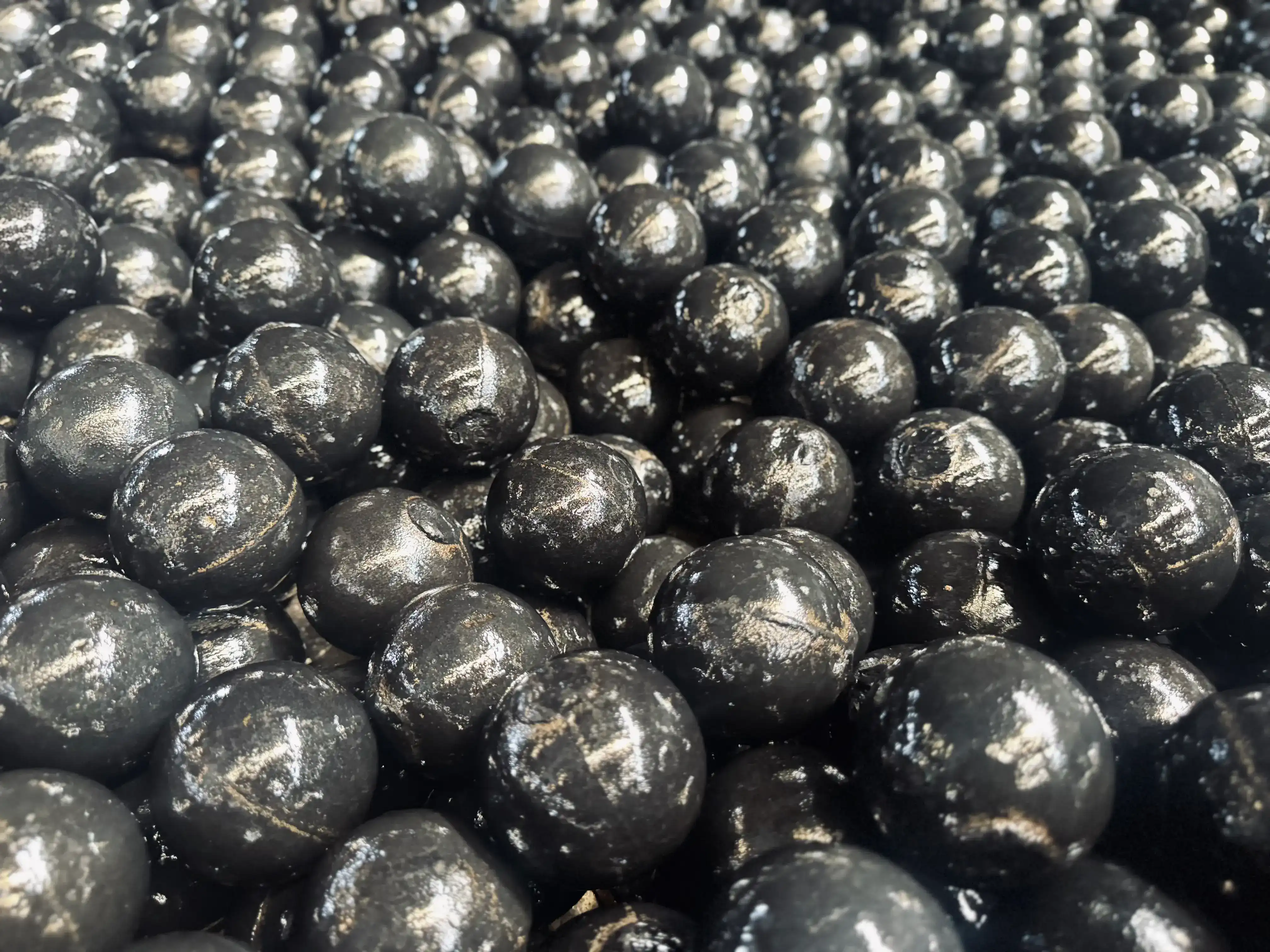 How does ball mill media influence final product color or clarity?