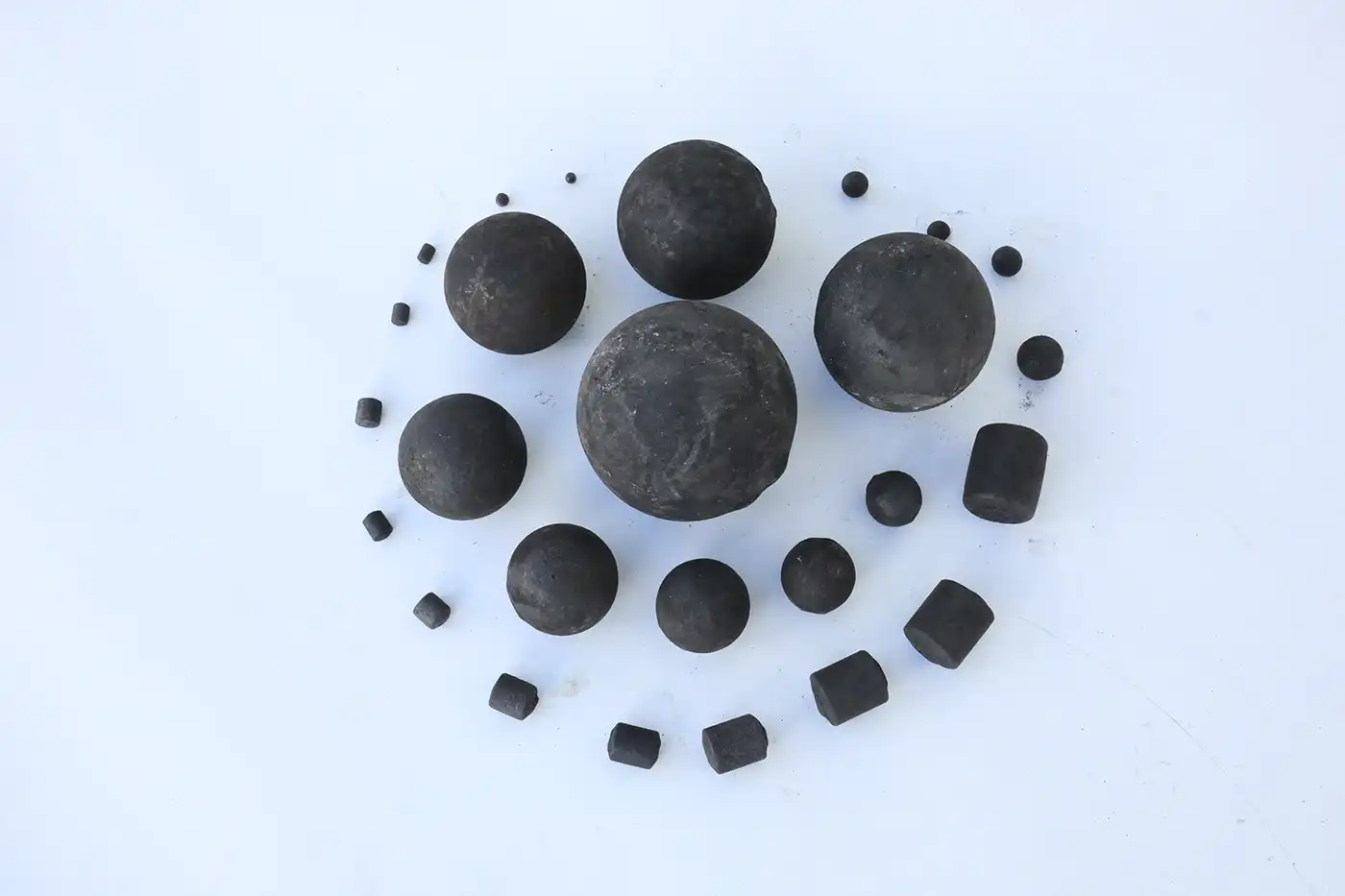 How do grinding balls affect cement fineness?